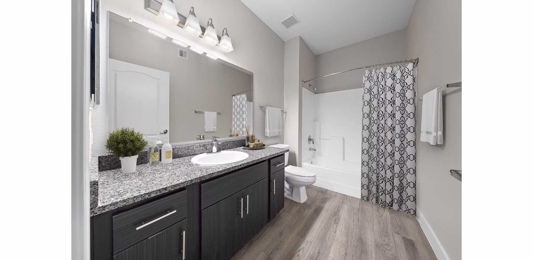 Luxury bathroom with modern fixtures at The Met at 3rd and Fillmore Apartments, a Greystar community
