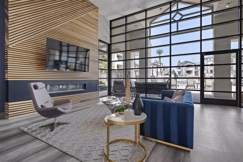 Clubhouse with modern design and seating areas at The Met at 3rd and Fillmore Apartments