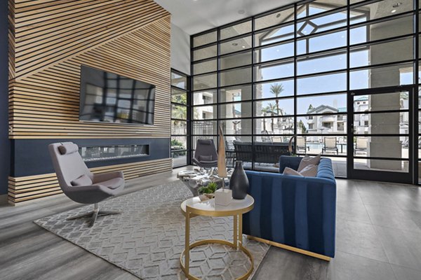 Clubhouse with modern design and seating areas at The Met at 3rd and Fillmore Apartments