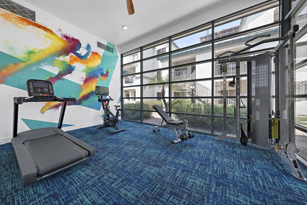 State-of-the-art fitness center with cardio machines at The Met at 3rd and Fillmore Apartments