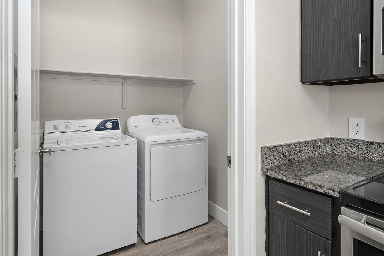 Laundry room at The Met At 3Rd And Fillmore Apartments