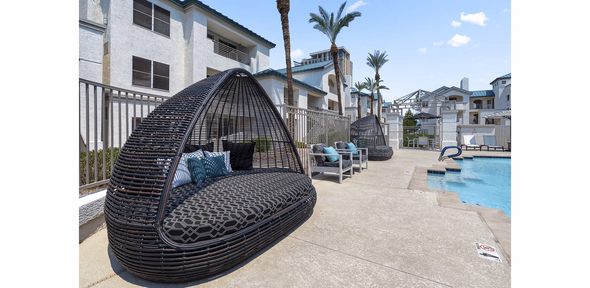 Rooftop pool with city views at The Met at 3rd and Fillmore Apartments