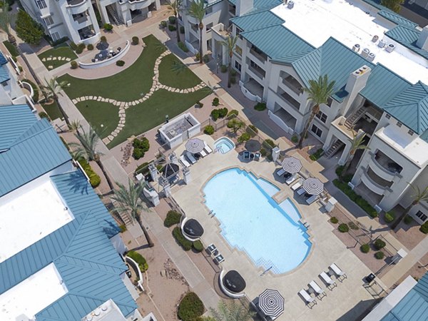 Luxury pool at The Met at 3rd and Fillmore Apartments featuring elegant design and ample lounge space for residents to relax and socialize