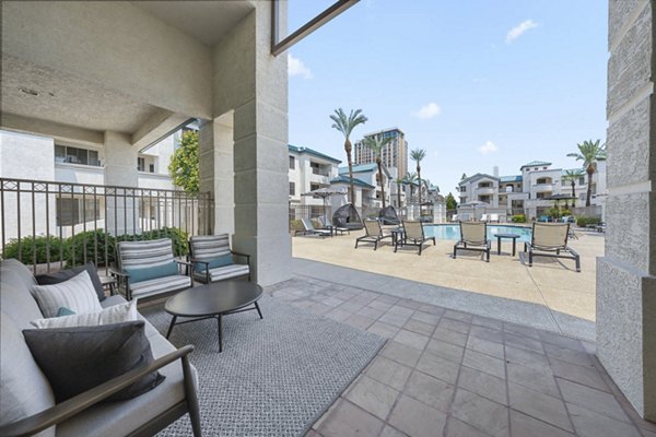 Chic outdoor patio with modern seating at The Met at 3rd and Fillmore Apartments