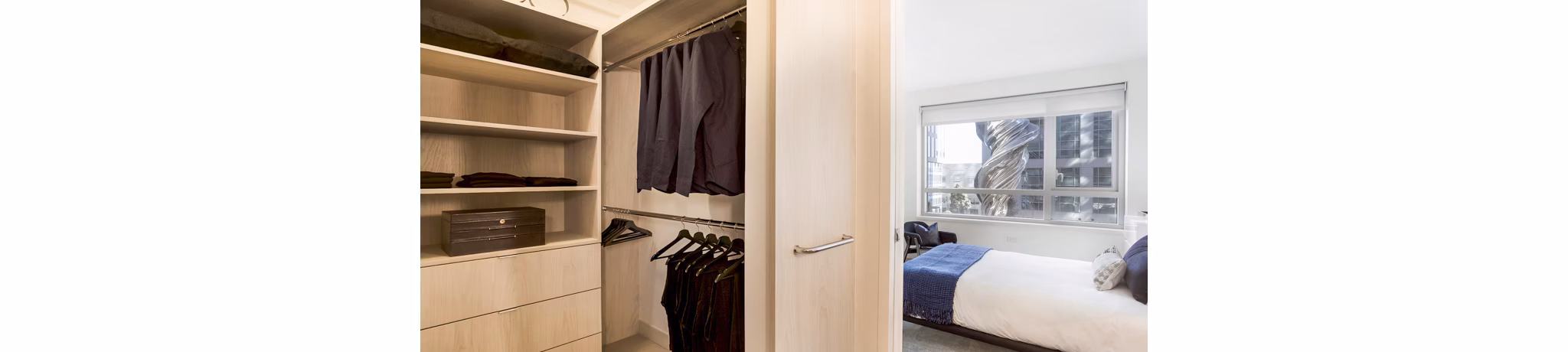 Stylish bedroom with modern decor at 33 8th St Apartments, offering luxury living in the heart of the city