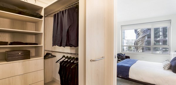 Stylish bedroom with modern decor at 33 8th St Apartments, offering luxury living in the heart of the city