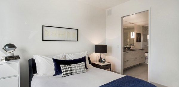Elegant bedroom featuring modern design at 33 8th St Apartments, a luxury Greystar property