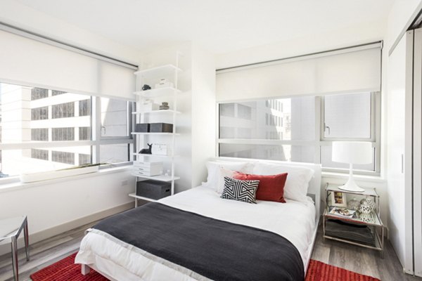 Cozy bedroom with modern decor at 33 8th St Apartments, luxury Greystar property in urban Boston