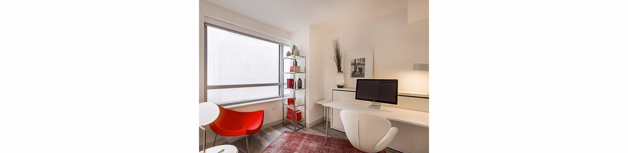 33 8th St Apartments: Cozy bedroom with modern decor in luxury Greystar apartment