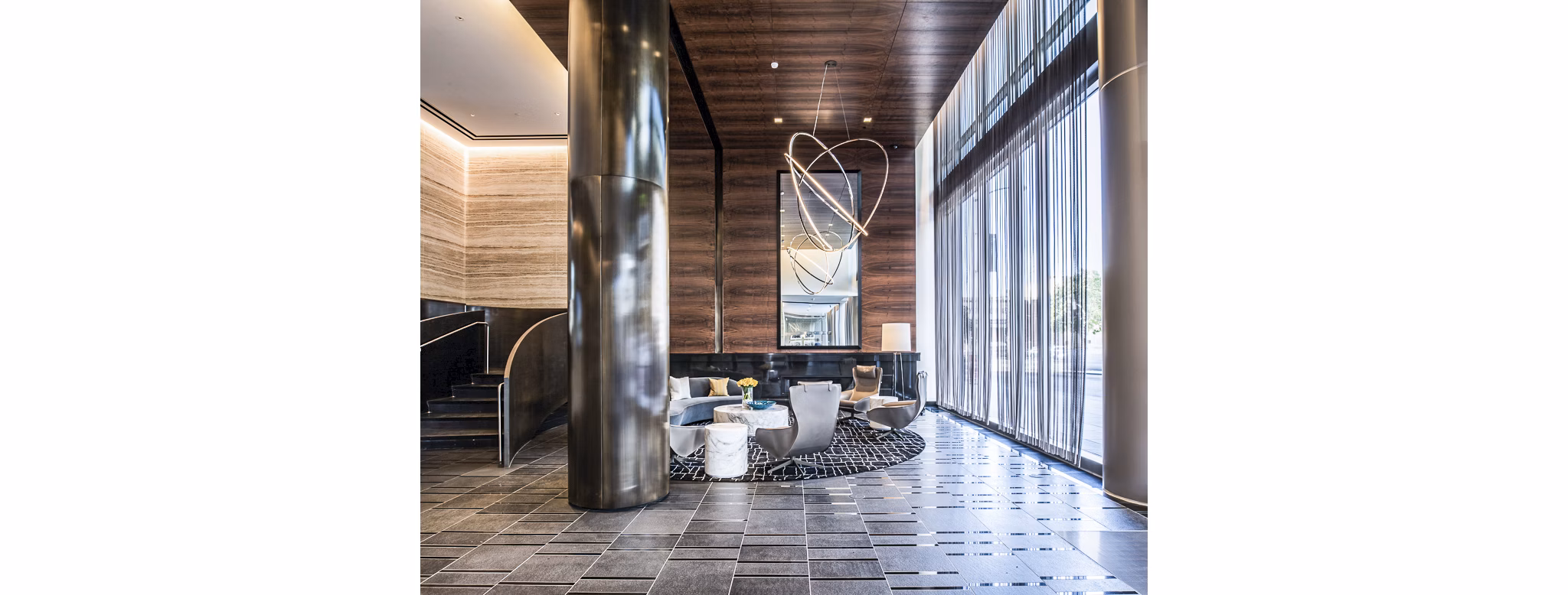 Clubhouse lobby with modern decor and seating at 33 8th St Apartments