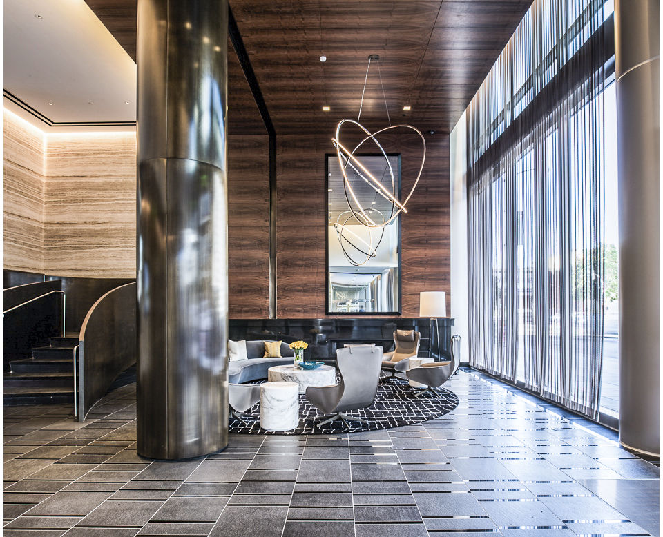 Clubhouse lobby with modern decor and seating at 33 8th St Apartments