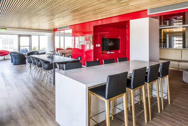 Clubhouse lobby featuring modern design and comfortable seating at 33 8th St Apartments, luxury living in the heart of the city