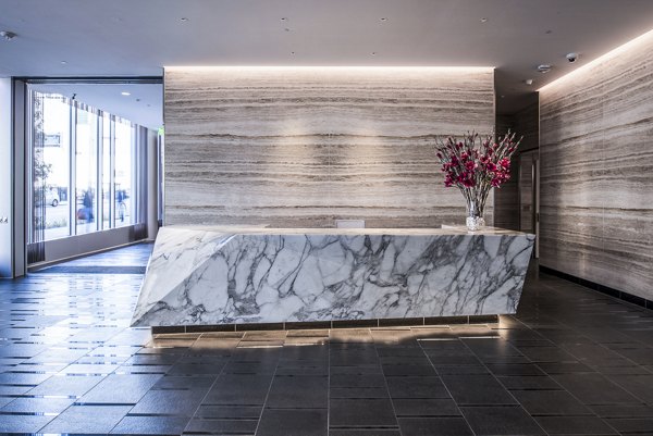 Elegant clubhouse lobby with modern seating and stylish decor at 33 8th St Apartments in luxury setting