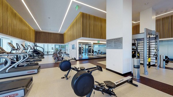 Modern fitness center with cutting-edge equipment at 33 8th Street Apartments, ideal for luxury living and active lifestyle enthusiasts