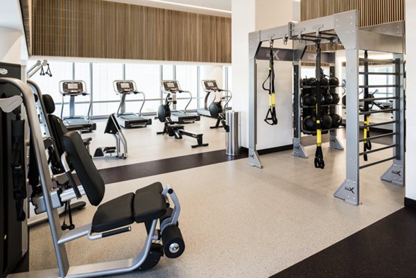 Fitness center with modern equipment at 33 8th St Apartments
