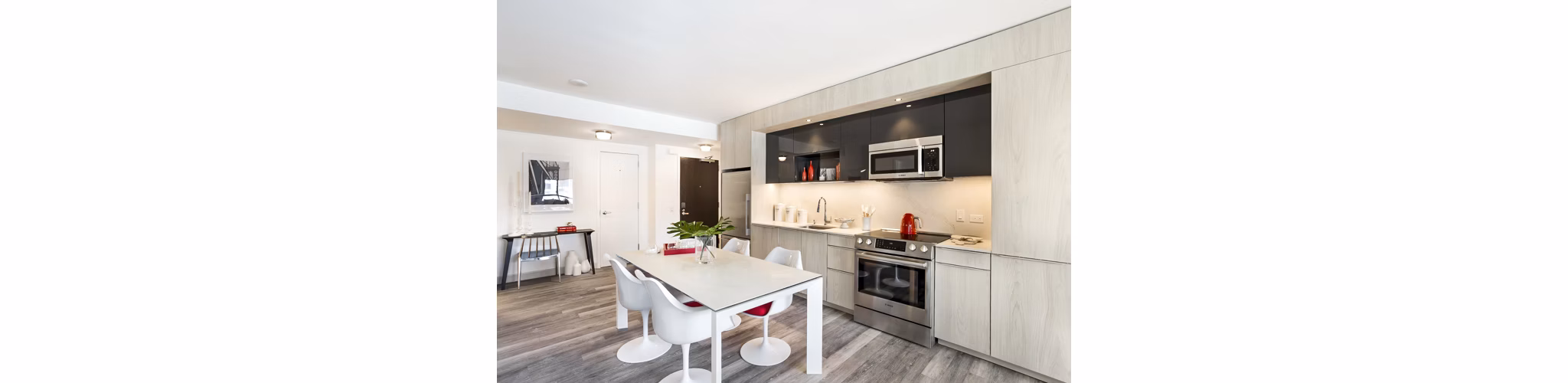 Modern kitchen with stainless steel appliances at 33 8th St Apartments