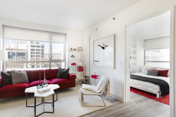 Spacious living room with modern decor at 33 8th St Apartments, offering a comfortable and stylish space for relaxation and entertainment