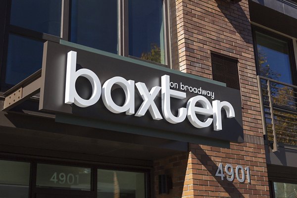 Baxter on Broadway Apartments: Modern signage showcasing property name and address
