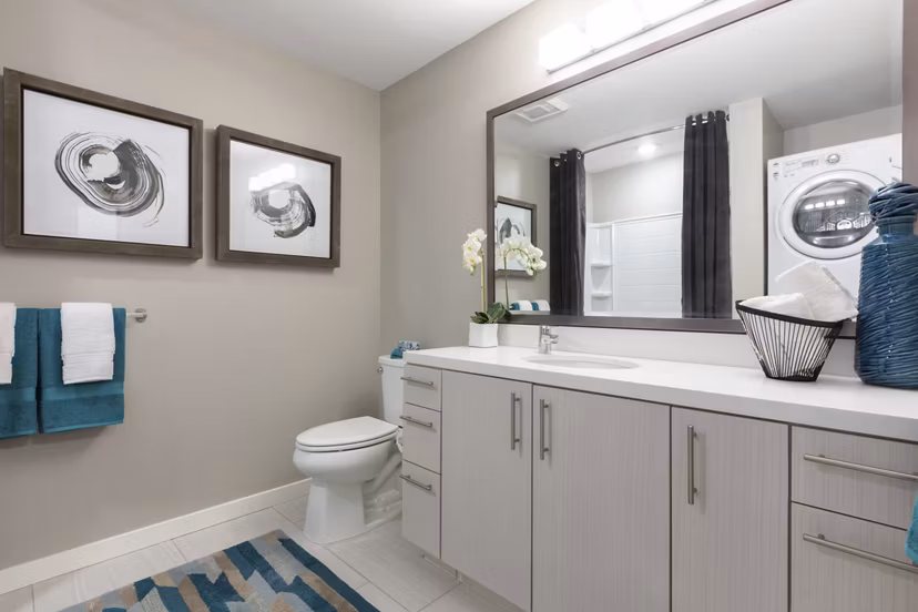 Baxter on Broadway Apartments: Modern bathroom with sleek fixtures and stylish tile design in luxury Oakland apartments