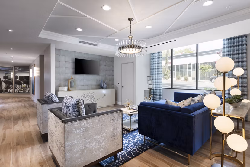 Clubhouse featuring modern decor and seating at Baxter on Broadway Apartments