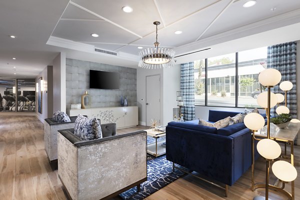 Clubhouse featuring modern decor and seating at Baxter on Broadway Apartments