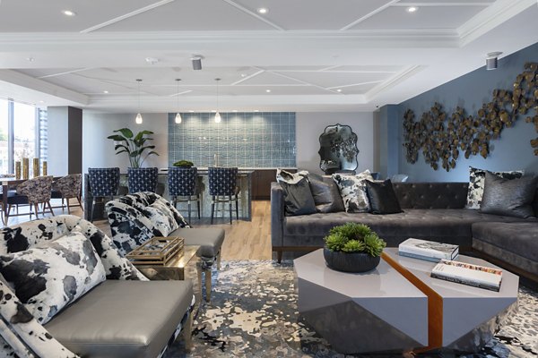 Clubhouse featuring modern design and cozy seating at Baxter on Broadway Apartments, a Greystar luxury property in vibrant Oakland