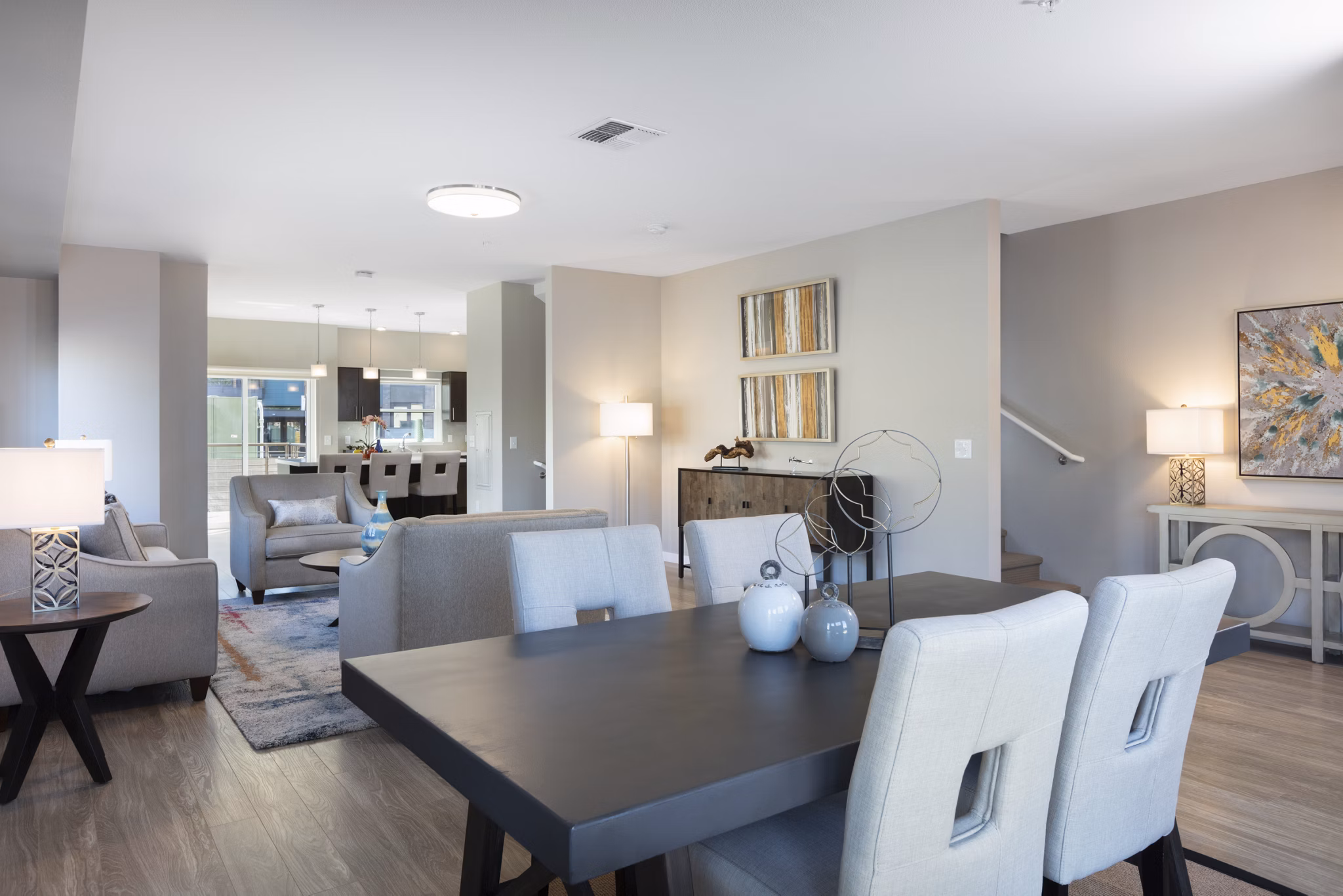 Dining area featuring modern decor and natural light at Baxter on Broadway Apartments in Oakland
