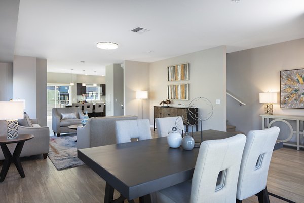 Dining area featuring modern decor and natural light at Baxter on Broadway Apartments in Oakland