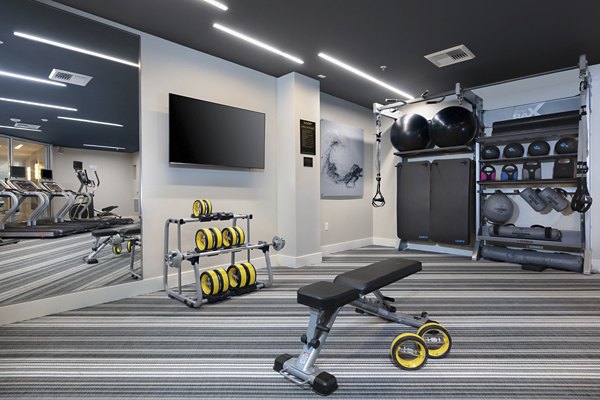 State-of-the-art fitness center equipped with modern gym facilities at Baxter on Broadway Apartments