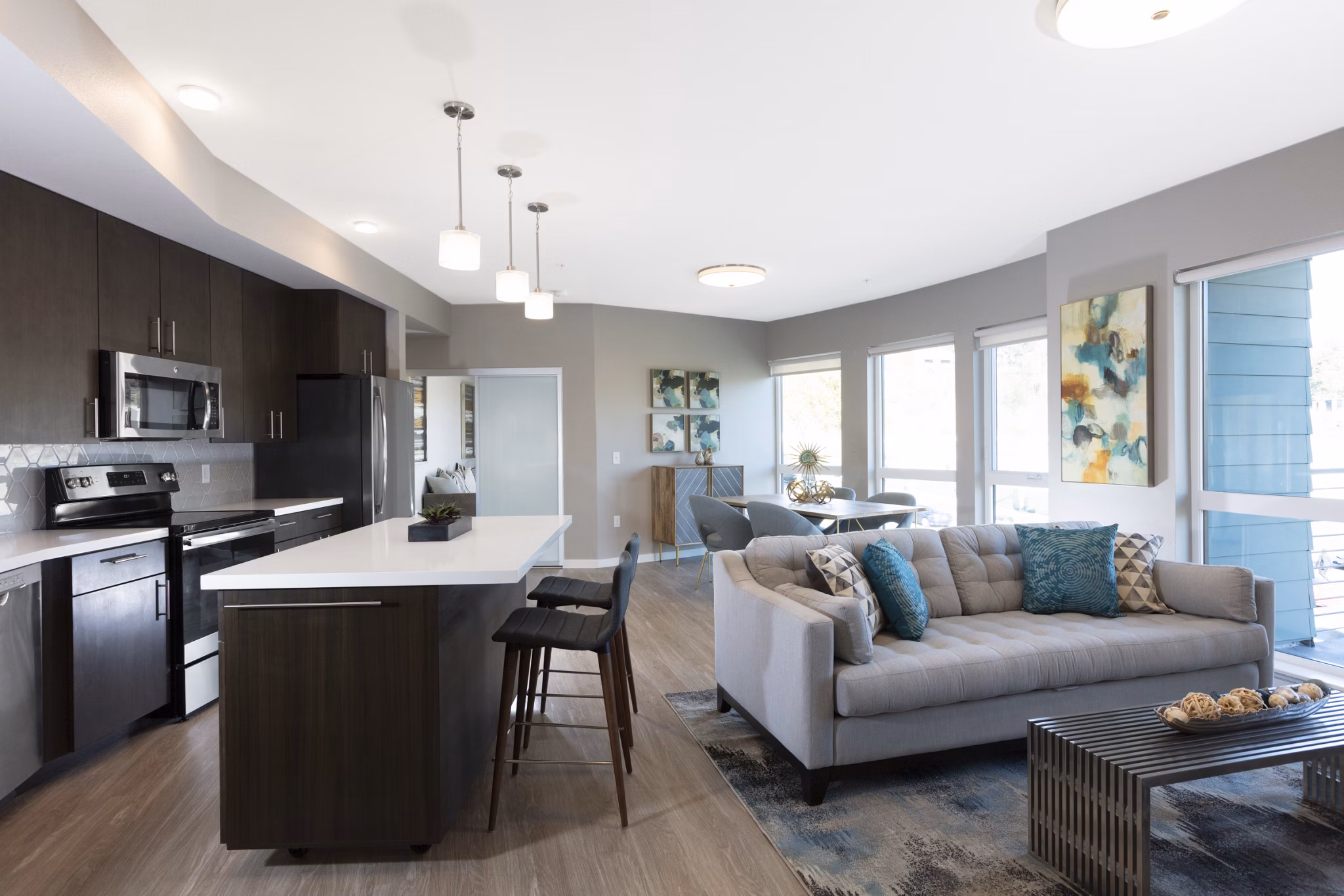 Modern kitchen with stainless steel appliances at Baxter on Broadway Apartments, a luxury offering in the Greystar portfolio