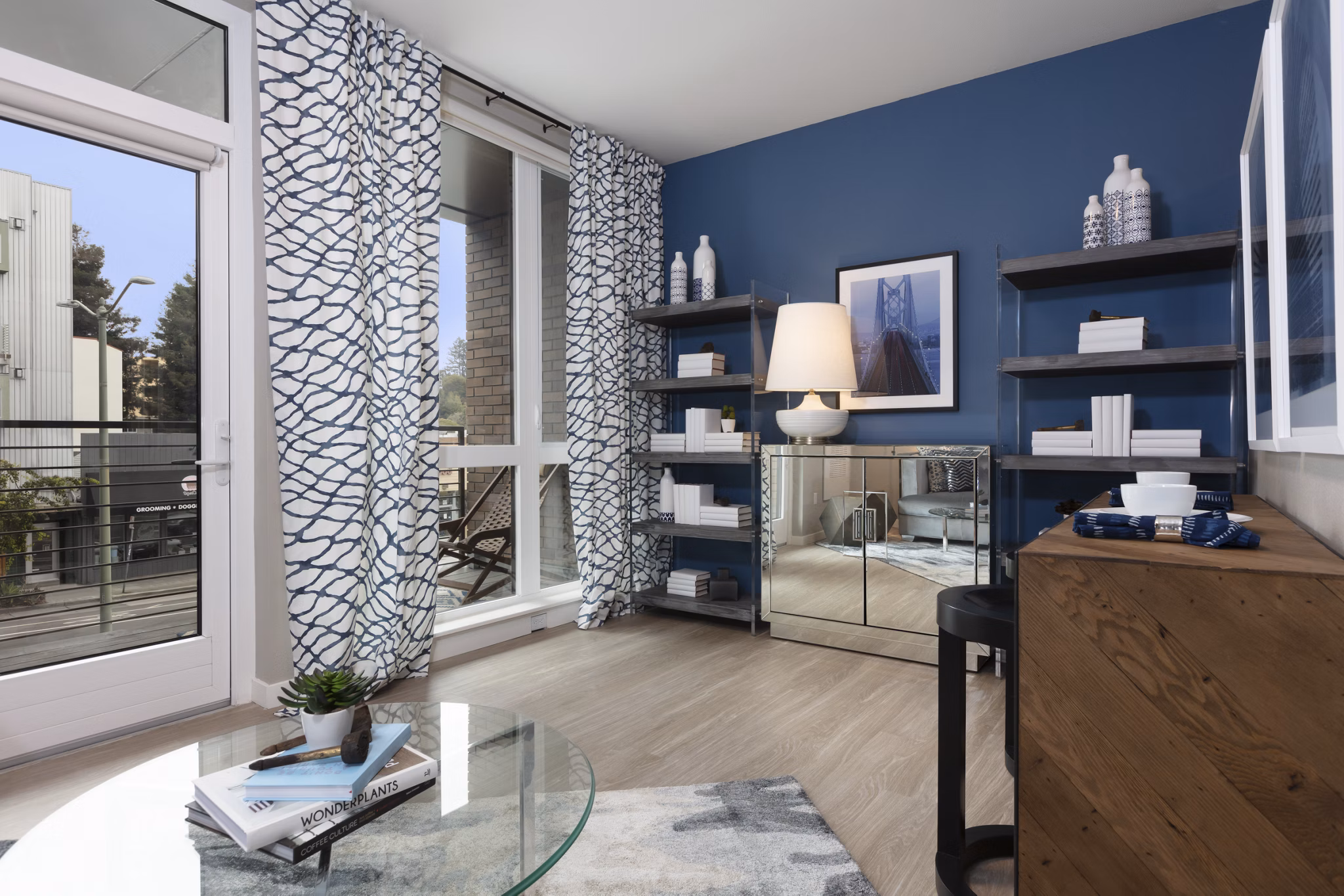 Modern living room with stylish decor and ample natural light at Baxter on Broadway Apartments