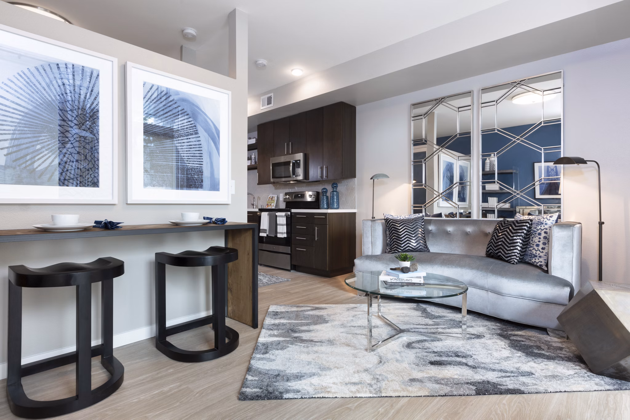 Spacious living room with modern furnishings at Baxter on Broadway Apartments in Oakland, perfect for luxury apartment living