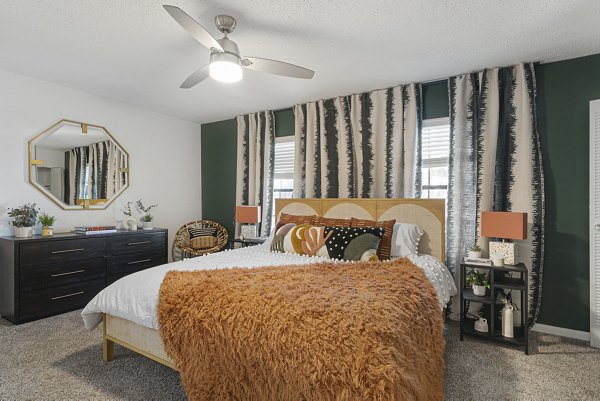 Modern bedroom with elegant decor at Aventura Bellevue Apartments, offering comfort and luxury amenities
