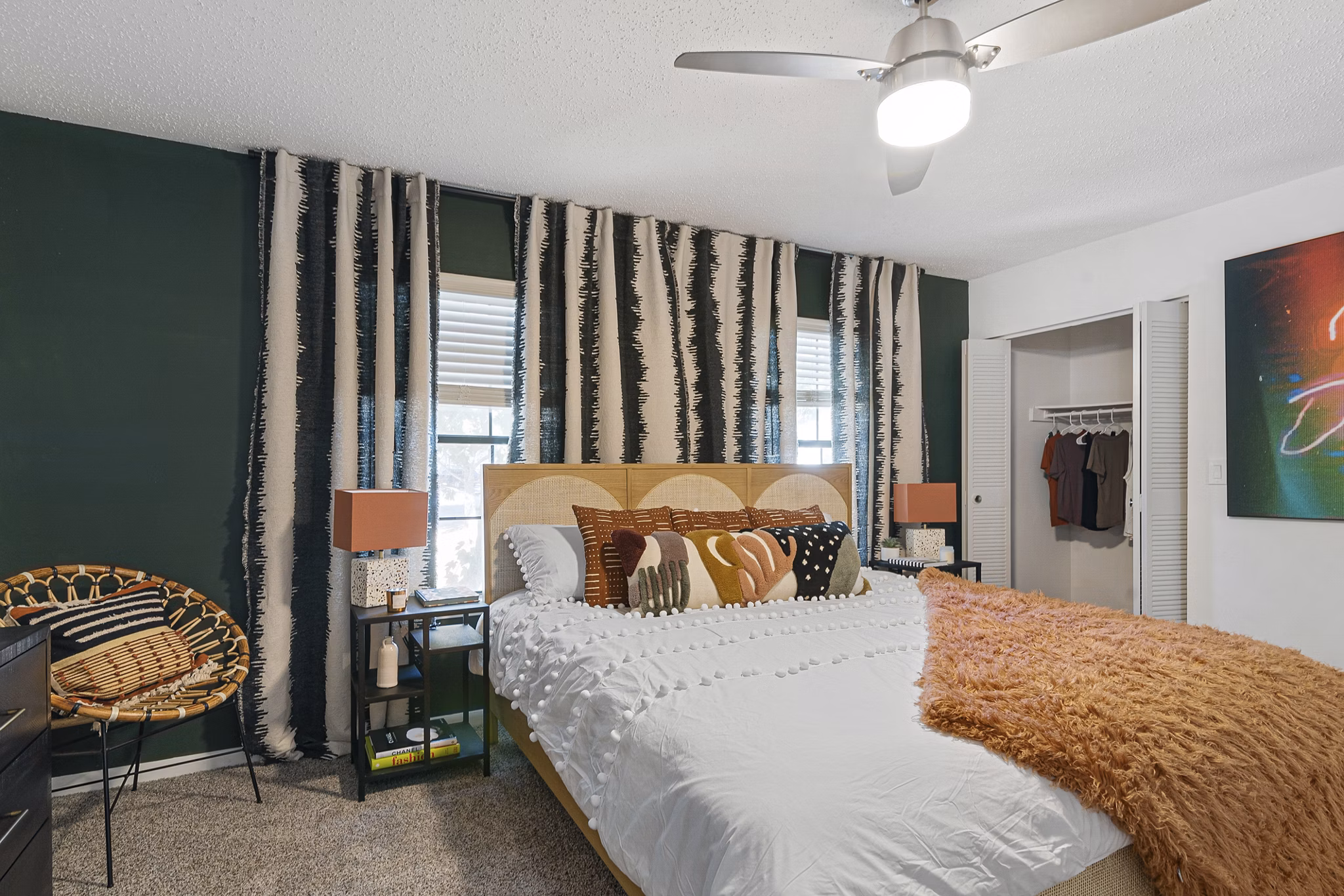 Cozy bedroom with modern furnishings in Aventura Bellevue Apartments