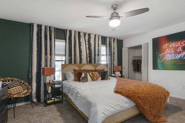 Cozy bedroom with modern decor and ample natural light at Aventura Bellevue Apartments