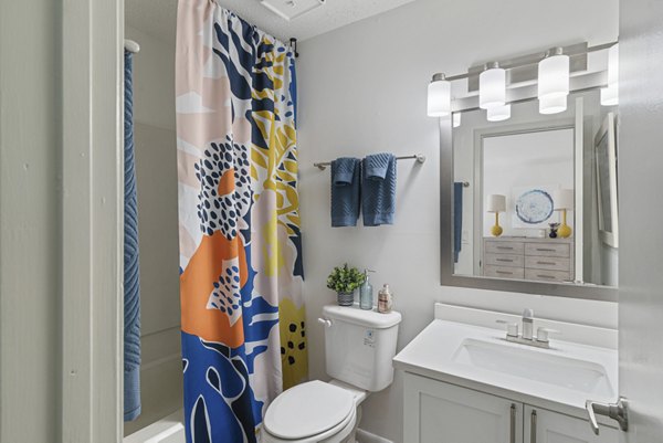 Modern bathroom with sleek fixtures and ample storage at Aventura Bellevue Apartments