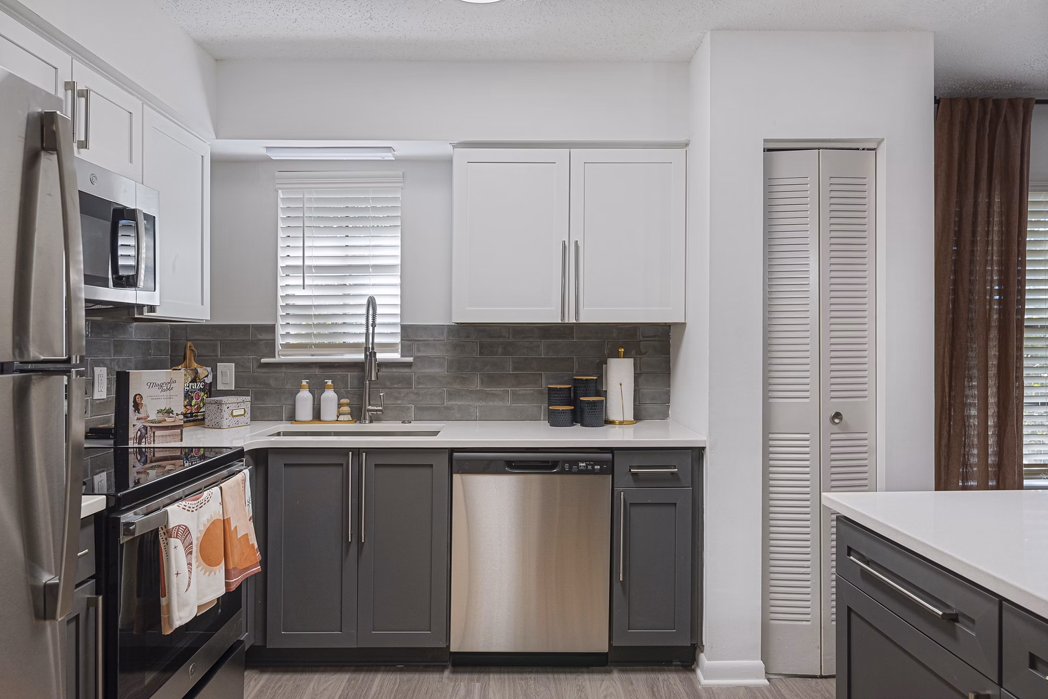 Modern kitchen with stainless steel appliances at Aventura Bellevue Apartments, a Greystar luxury property in Bellevue