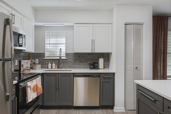Modern kitchen with stainless steel appliances at Aventura Bellevue Apartments, a Greystar luxury property in Bellevue
