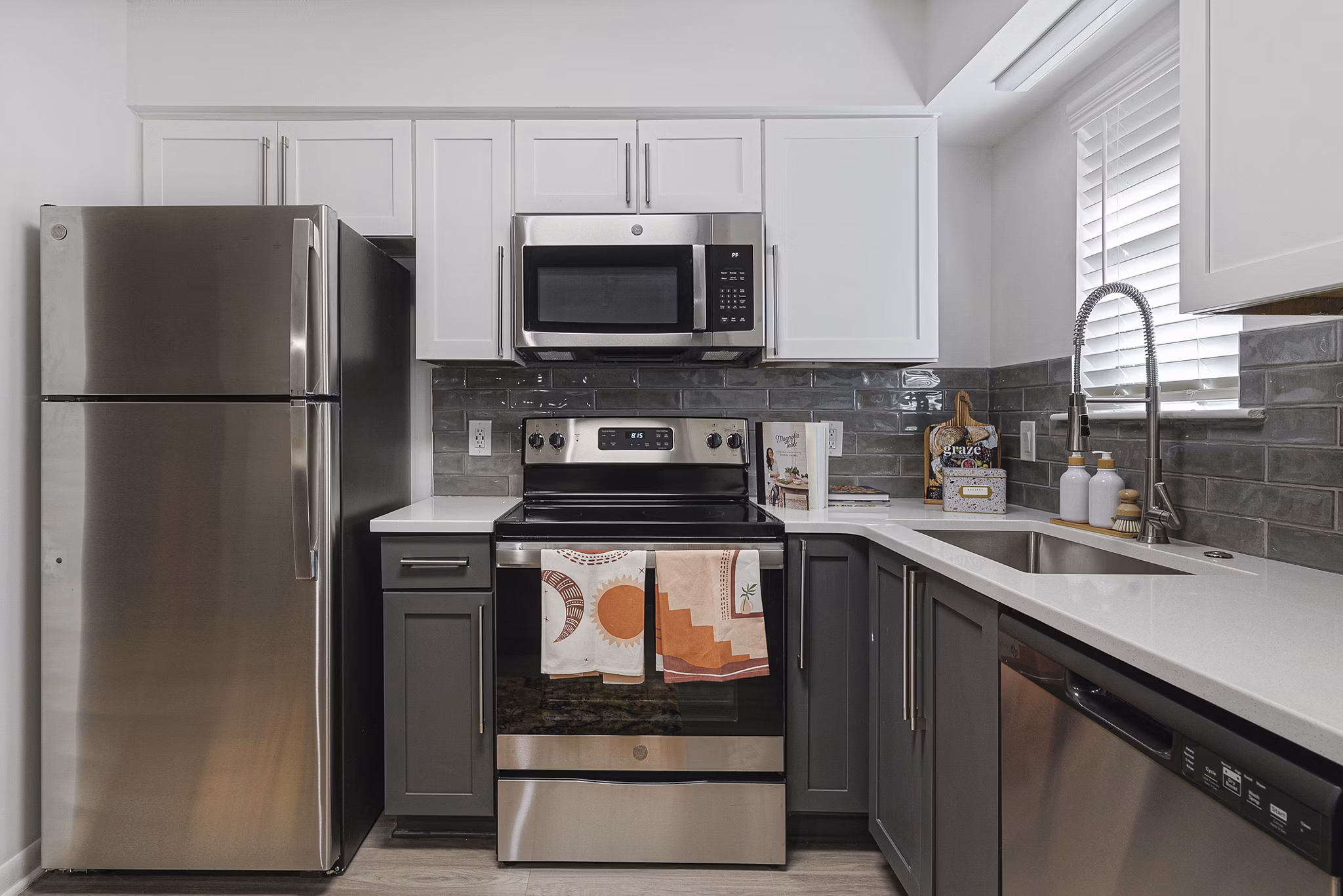 Modern kitchen with stainless steel appliances at Aventura Bellevue Apartments
