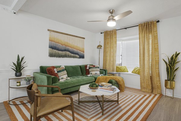 Spacious living room with modern decor in Aventura Bellevue Apartments