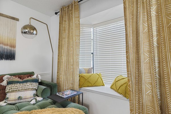 Spacious living room with modern design and plush seating at Aventura Bellevue Apartments, offering luxurious comfort and style