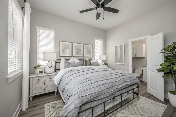Wingspan at Bridgeland Apartments: Modern bedroom with stylish dÃ©cor and abundant natural light