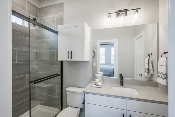 Modern bathroom with stylish fixtures at Wingspan at Bridgeland Apartments