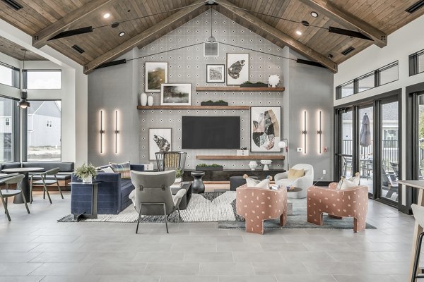 Wingspan at Bridgeland: Modern clubhouse featuring stylish seating and vibrant decor in luxury apartments