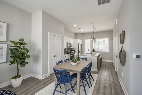 Dining area with modern decor at Wingspan at Bridgeland Apartments offering luxury lifestyle in serene surroundings