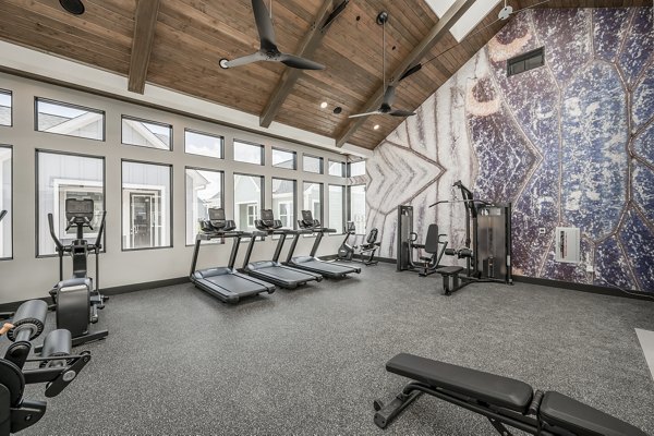 Modern fitness center with state-of-the-art equipment at Wingspan at Bridgeland Apartments, perfect for an active lifestyle