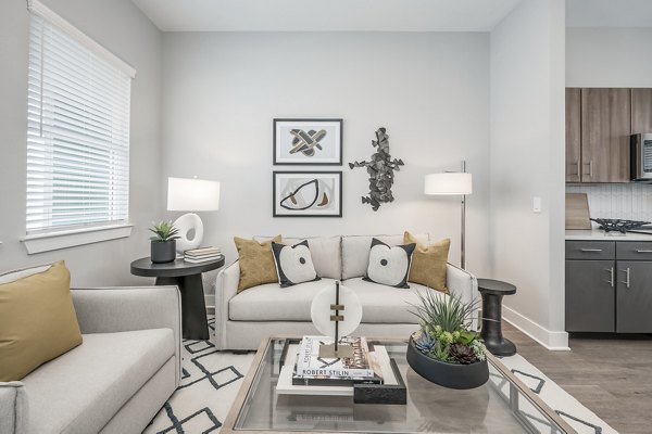 Spacious living room with modern decor in Wingspan at Bridgeland Apartments