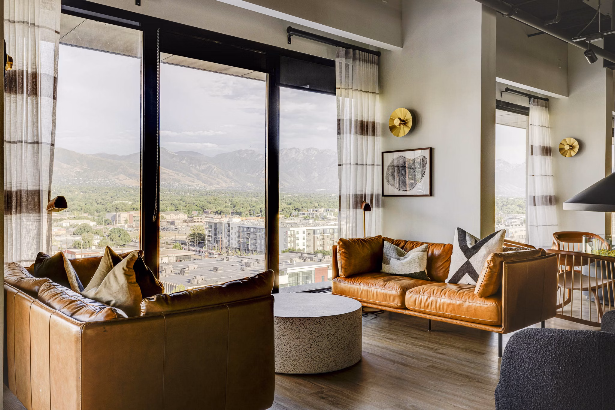 Clubhouse with modern furniture and open seating area at Lattice Apartments, ideal for social gatherings and events