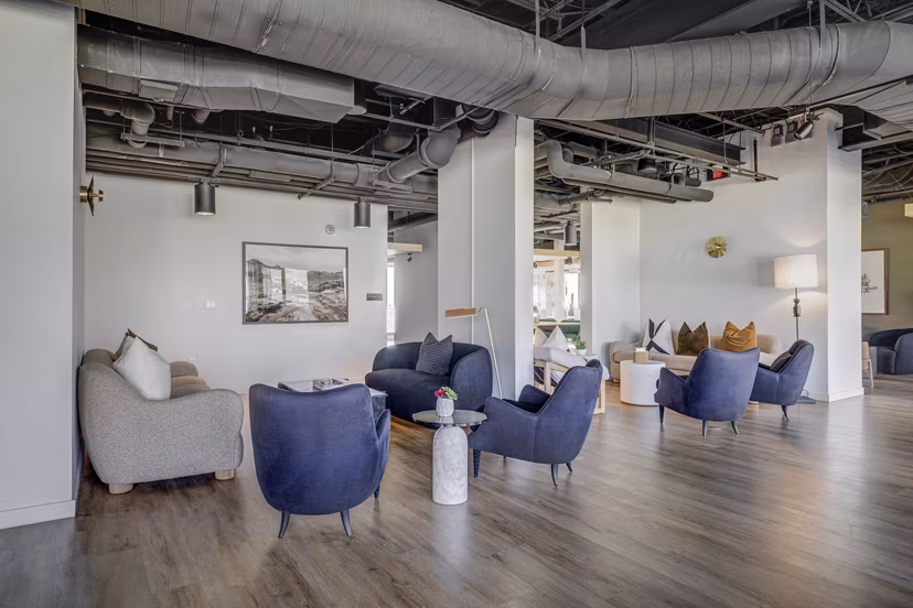 Modern clubhouse with cozy seating and entertainment options at Lattice Apartments