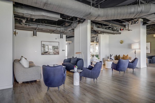 Modern clubhouse with cozy seating and entertainment options at Lattice Apartments